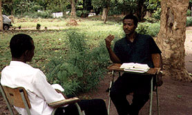 Two priests sharing outside